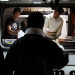 homeless man getting food from drive at homeless shelter after fleeing domestic violence