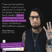 Janes Addiction Guitarist Dave Navarro stands next to the words "I have seen firsthand how domestic violence can not only destroy the victim's life, but the lives of friends and family members. Help me spread awareness and put an end to domestic violence. Support Safe Horizon's hashtag put a nail in it campaign