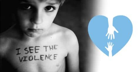 A Young Boy Has "I See the Violence" written on his chest