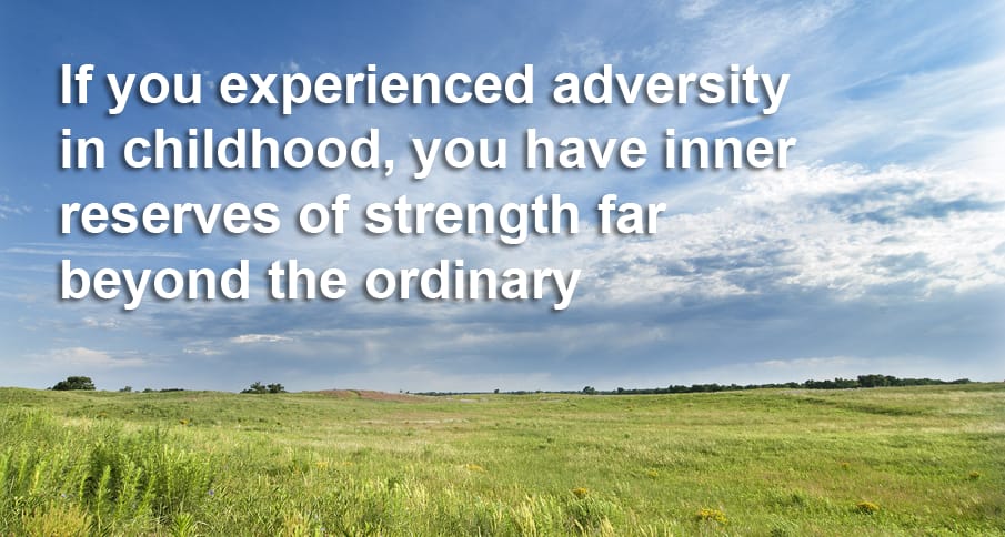 Text hangs over a grassy sunlit field: If you experienced adversity in childhood, you have inner strength far beyond the ordinary